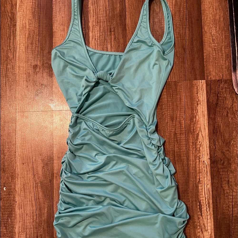 Teal Mini Dress, with a tie front and stomach cut out.
